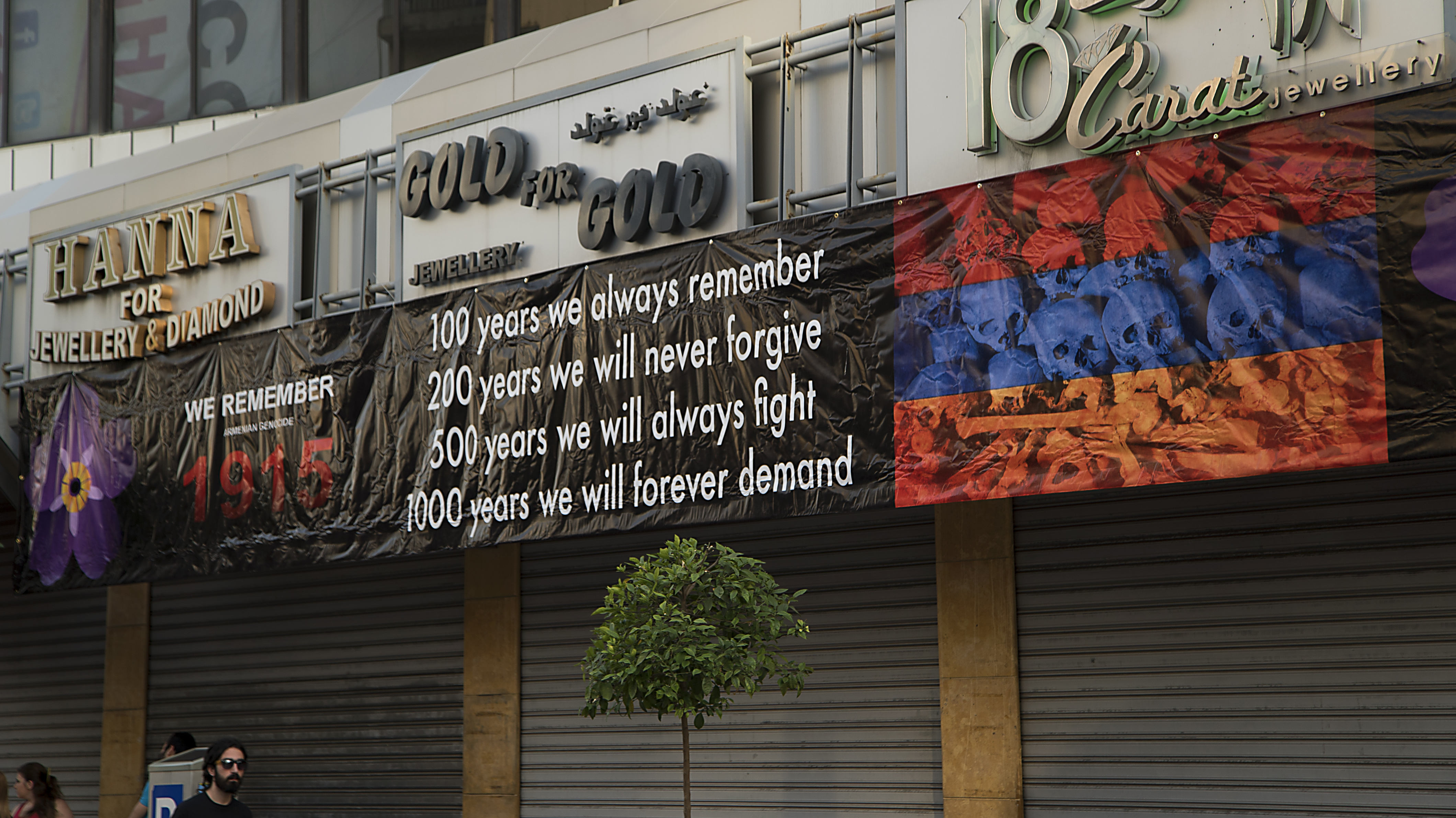 April 24, 2016 Bourj Hammoud, Beirut, Lebanon A banner hanging above shuttered jewellery shops in Bourj Hammoud calls for recognition and remembrance of the Armenian Genocide. Jewellery is a trade Armenians in Lebanon brought with them when the migrated from Anatolia in the early 20th century.
