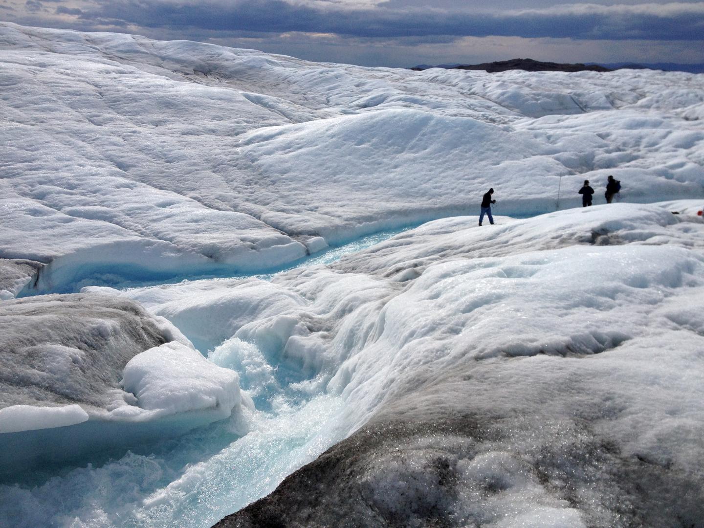 A team from Rutgers University and the University of Georgia measures meltwater runoff from the ice sheet margin in Greenland during summer 2013. (Rutgers University/Asa Rennermalm)