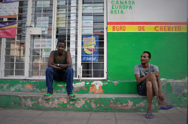 Merhaini and Mehani, migrants from Eritrea, sit in a street in Tapachula in December 2016. (Irene Savio)