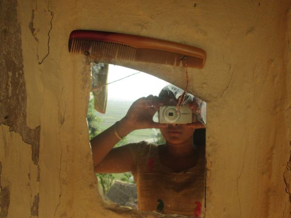 “This is a picture of the mirror and comb I use at my house. In our society, when girls experience their first menstruation, we are not allowed to look into mirrors or comb our hair. I think that is a wrong belief that we have in our society. My family does not follow this practice. But many of my friends’ families are really strict, so they aren’t allowed to look at themselves in the mirror and comb their hair. If my friends could grow up in an environment where there are no limitations during menstruation and receive more support from their families, they could feel free and have more opportunities.” (WaterAid/Sushma Diyali)