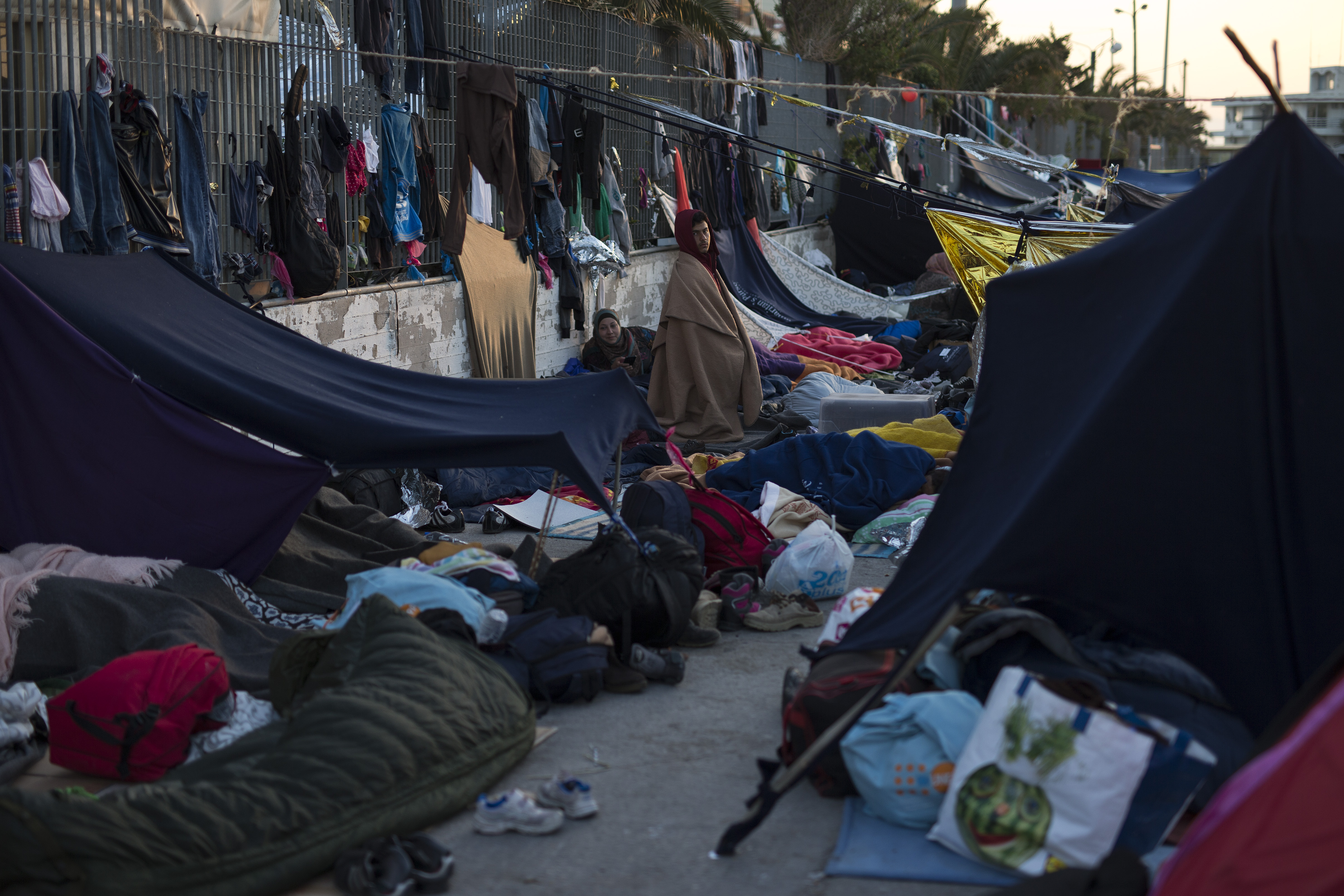 Migrants and refugees sleep at the port of the Greek island of Chios, Wednesday, April 6, 2016. (AP/Petros Giannakouris)