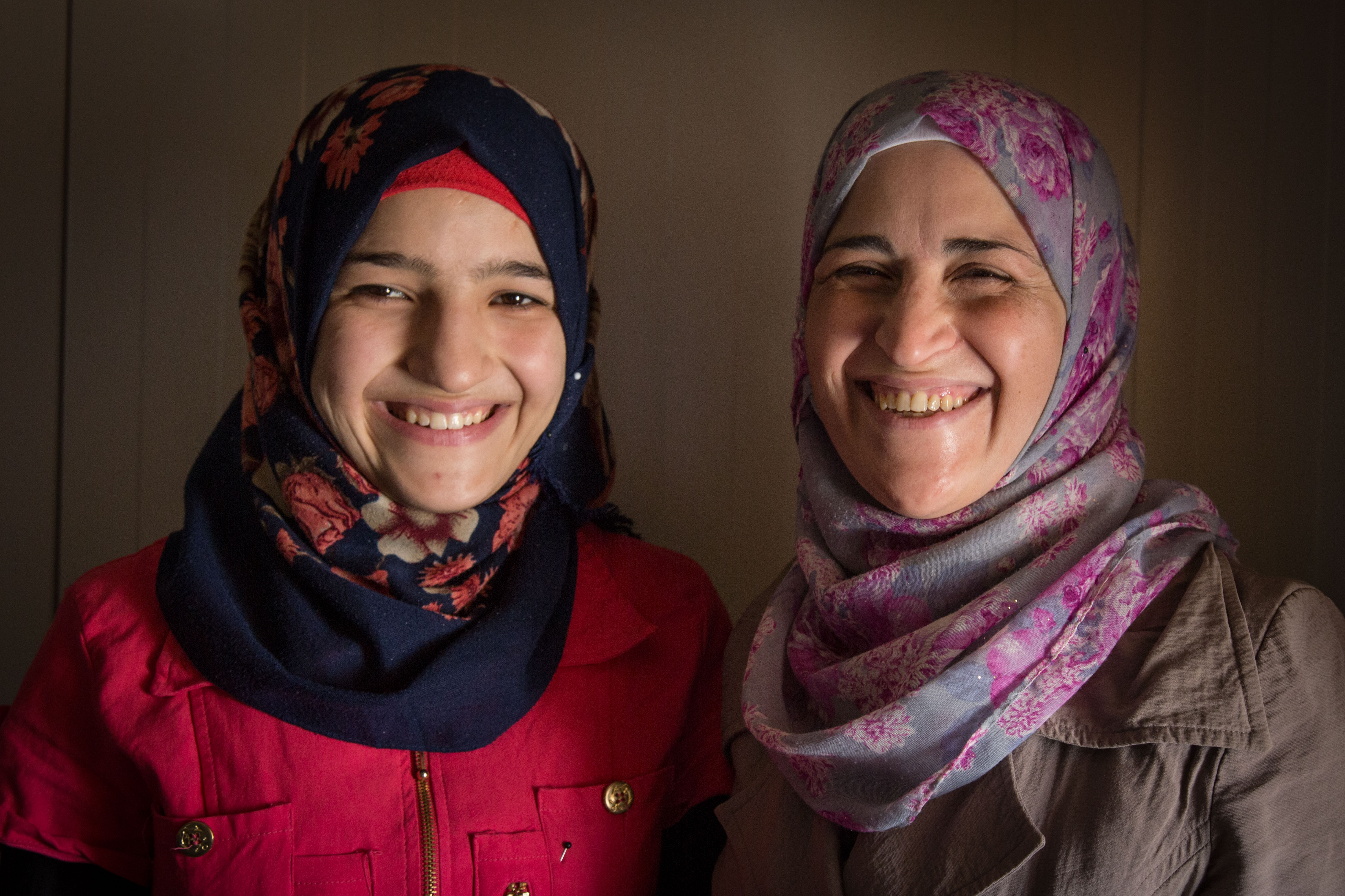 Saba's mother, Izdihar, helps her convince families not to marry off their young daughters. "Despite the circumstances and the pressures, education is the priority," says Izdihar. "Education is a weapon, a diploma is a weapon." (Sima Diab/UNFPA)