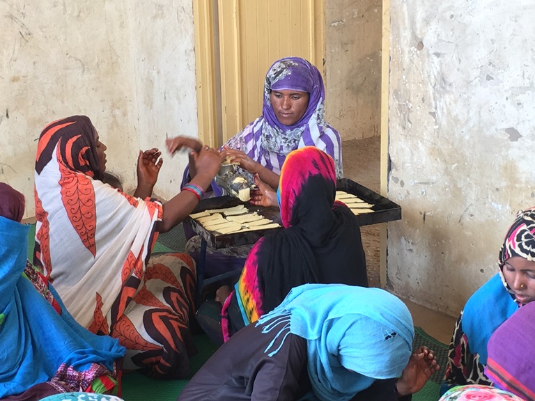 Women in desert villages in Sudan's River Nile state are being taught how to bake and make dairy products to diversify local economies that rely on agriculture. (Hannah McNeish)